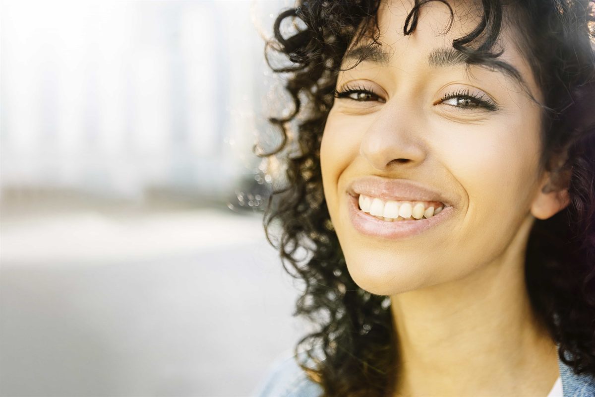 A patient smiling after professional teeth whitening